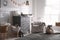 Chest of drawers with changing tray and pad in baby room. Interior