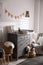 Chest of drawers with changing tray and pad in baby room. Interior