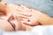 Chest massage of woman by hands of massage therapist