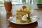 Chestnut with caramel salted cake serving with cookies on flower pattern plate