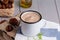 Chestnut soup in white enamel mug with roasted chestnuts