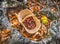Chestnuts background top view - harvesting chestnut in forest with basket in autumn foliage ground