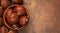 Chestnuts in a bowl  on a wooden background. Autumn fall seasonal composition with horse chestnuts. Copyspace