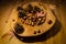 Chestnuts and hazelnuts on a wooden bowl over a wood table