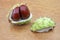 Chestnuts with prickly shell lying on a wooden table