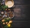 Chestnuts soup cooking ingredients with pot and spoon on dark rustic background, top view, place for text. Seasonal food