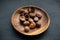 Chestnuts on wooden plate