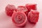 Chewy sweets and strawberry and cherry flavoured gummy candy concept with close up on sweet and sour red sour belts covered in