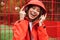 Chherful attractive young girl wearing raincoat