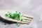 Chia microgreens close up. Sprouts on a wooden fork. selective focus