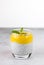 Chia pudding with mango puree, mint leaf on gray background, copy space. The concept of healthy food and vegan desserts.