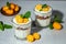 Chia pudding parfait, layered with kumquat and granola. breakfast. Healthy food concept. place for text