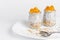Chia seed pudding with orange and oats on white background. Breakfast and superfood concept.