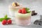 Chia seed pudding with three flavors, cocoa, matcha and strawberry with yoghurt, chocolate and mint leaves, horizontal orientation