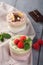 Chia seed pudding with three flavors, cocoa, matcha and strawberry with yoghurt, chocolate and mint leaves. Vertical orientation