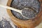Chia seed in a wooden spoon on the table. Healthy eating. Vegan food concept