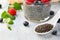 Chia seeds with Healthy chia pudding with coconut milk and fresh berry in a glass