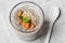 Chia seeds pudding with oat, banana and almonds decorated with mint leaves