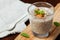 Chia seeds pudding with oat, banana and almonds decorated with mint leaves