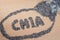 Chia word made from pouring chia seeds on wooden plate
