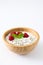 Chia yogurt with raspberries in a wooden bowl