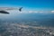 Chiang Mai International Airport and surrounding area with clear blue sky view from airplane window