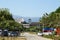 Chiang Mai, Thailand - December 20, 2017: City view on a road, parking, high-rise buildings and mountains.