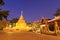 Chiang Mai, Thailand - December 27, 2018: Golden buddha relic pagoda at Wat Phra That Si Chom Thong Worawihan at twilight