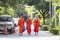 CHIANG MAI, THAILAND - FEBRUARY 17, 2019 : Buddhist monks walk at the Buddhist Temple in Chiang Mai