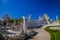 CHIANG RAI, THAILAND - FEBRUARY 01, 2018: Side view of unidentified people at the enter of white temple located in