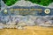CHIANG RAI, THAILAND - July 18, 2020 : Thamluang Khunnam Nangnon National Park entrance sign with stone surrounding and trees