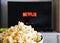 CHIANGMAI, THAILAND - JULY 5, 2019- Netflix logo on Smart TV and Popcorn bowl