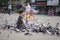 Chiangmai Thailand - March 16, 2018 : Chinese tourists are having fun with pigeons at Chiang Mai Gate.