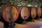 Chianti wine aging in wooden barrels at a vineyard cellar in Tuscany, Italy