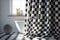 Chic black and white checkered gauze shower curtain in the bathroom. Photorealistic shot generated by AI