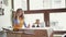 Chic business lady writing, using phone at the table in cafe