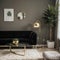 Chic mid-century modern luxury aesthetics living room with gray velvet couch and golden lamp