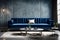 A chic velvet blue sofa set against a contemporary concrete wall, enhanced by subtle accent lighting