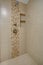 Chic Walk-in shower with beige subway tiled interior