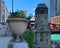 Chicago architectural detail on Wacker Dr in summer, with flower planter on bannister in foreground, and bridgehouse guarding