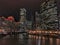 Chicago cityscape illuminated with Christmas holiday decorations and city night lights reflecting on the river.