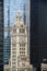 Chicago clock tower with skyscrapers