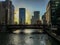 Chicago River at sunset while kayaks float through the Loop.