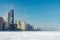 Chicago Skyline seen from Ohio Street Beach with Lake Michigan covered in Snow and Ice after a Polar Vortex