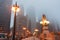 Chicago street as mist descends and lights come on Upper Wacker