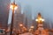 Chicago street as mist descends and lights come on Upper Wacker Drive with ornate lights tall buildings rising into fog