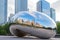 Chicago, USA - may 26, 2018: Reflection of city buildings on a metal surface of Cloud Gate also known as the Bean, Millennium Park