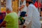 CHICHEN ITZA, MEXICO - NOVEMBER 12, 2017: Close up of Indian chaman using plants to cure an old woman inside of a store