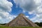 Chichen itza pyramid in a blue sky day back view