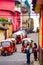 Chichicastenango, Guatemala on 2th May 2016: Indigenous person informing people with louspeaker in a street full of Tuk Tuk